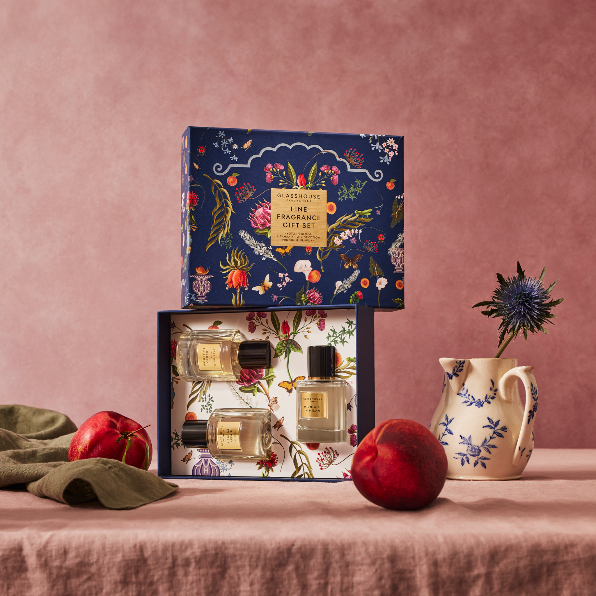 Glasshouse Fragrances Fine Fragrance Gift set, 3 x 1.7 fl. oz. Eau de Parfum with decorative box on a table with fruit.