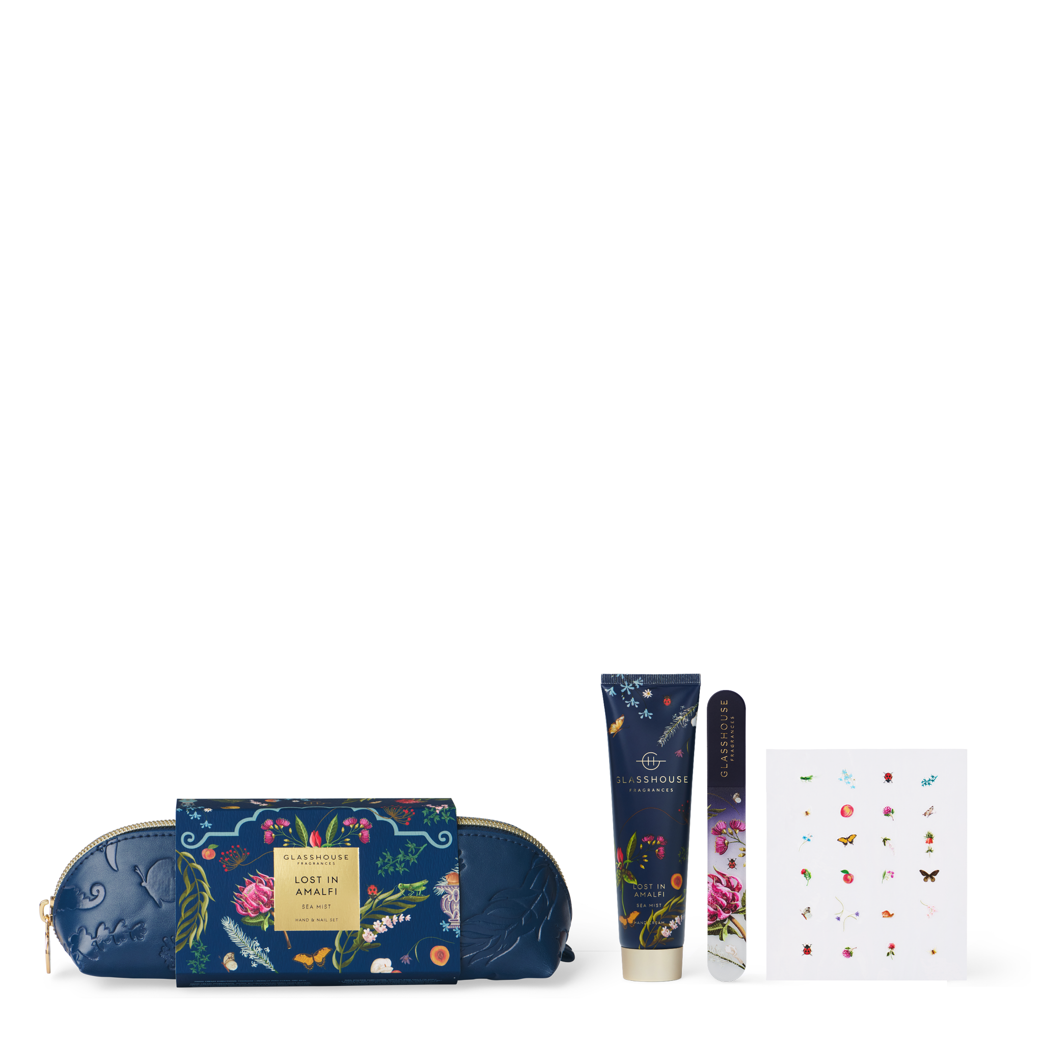 Glasshouse Fragrances Lost In Amalfi Hand and Nail Kit with a blue cosmetic pouch, Hand Cream and a Glass Nail File with decorative Nail Stickers.
