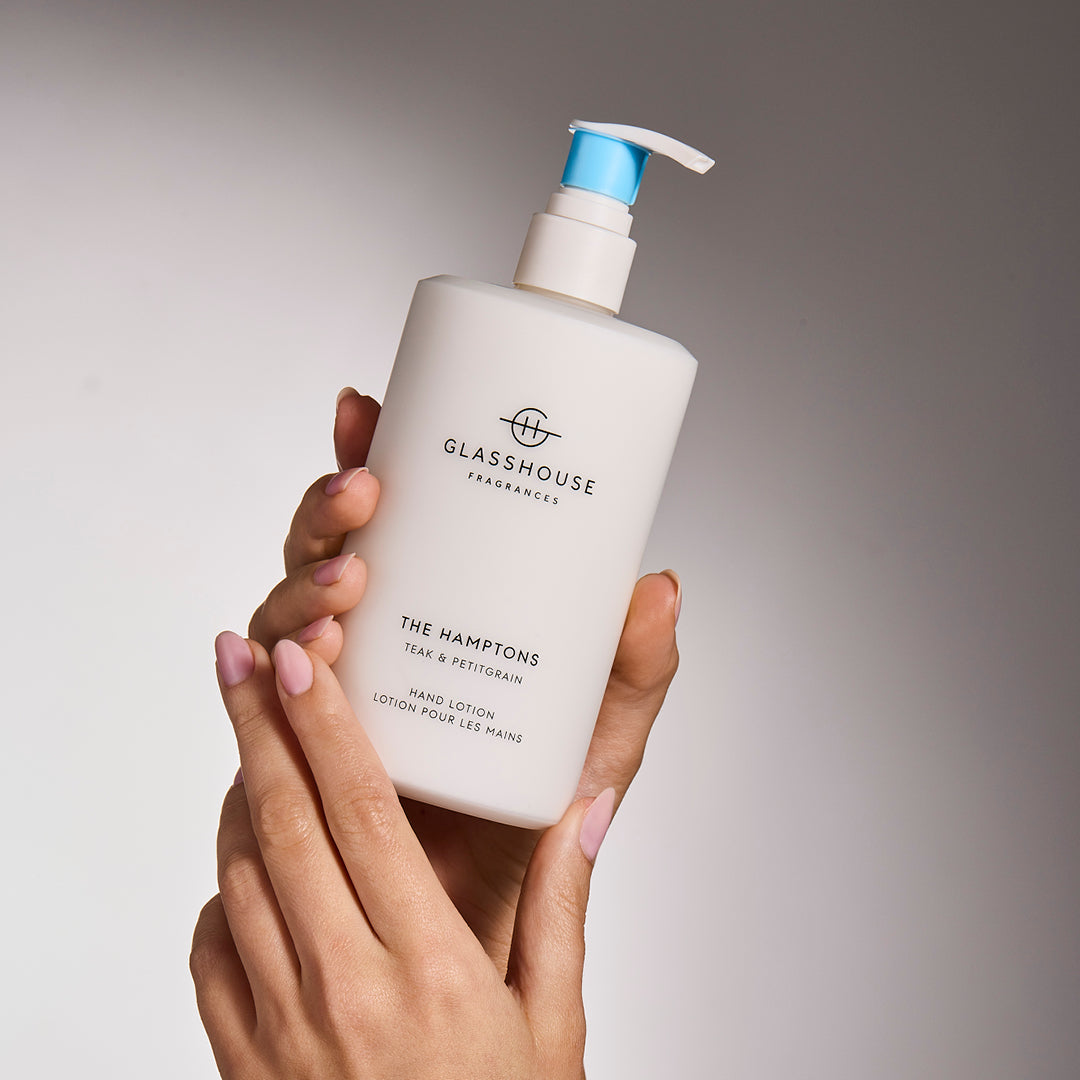 Glasshouse Fragrances The Hamptons Hand Lotion close up in hands.