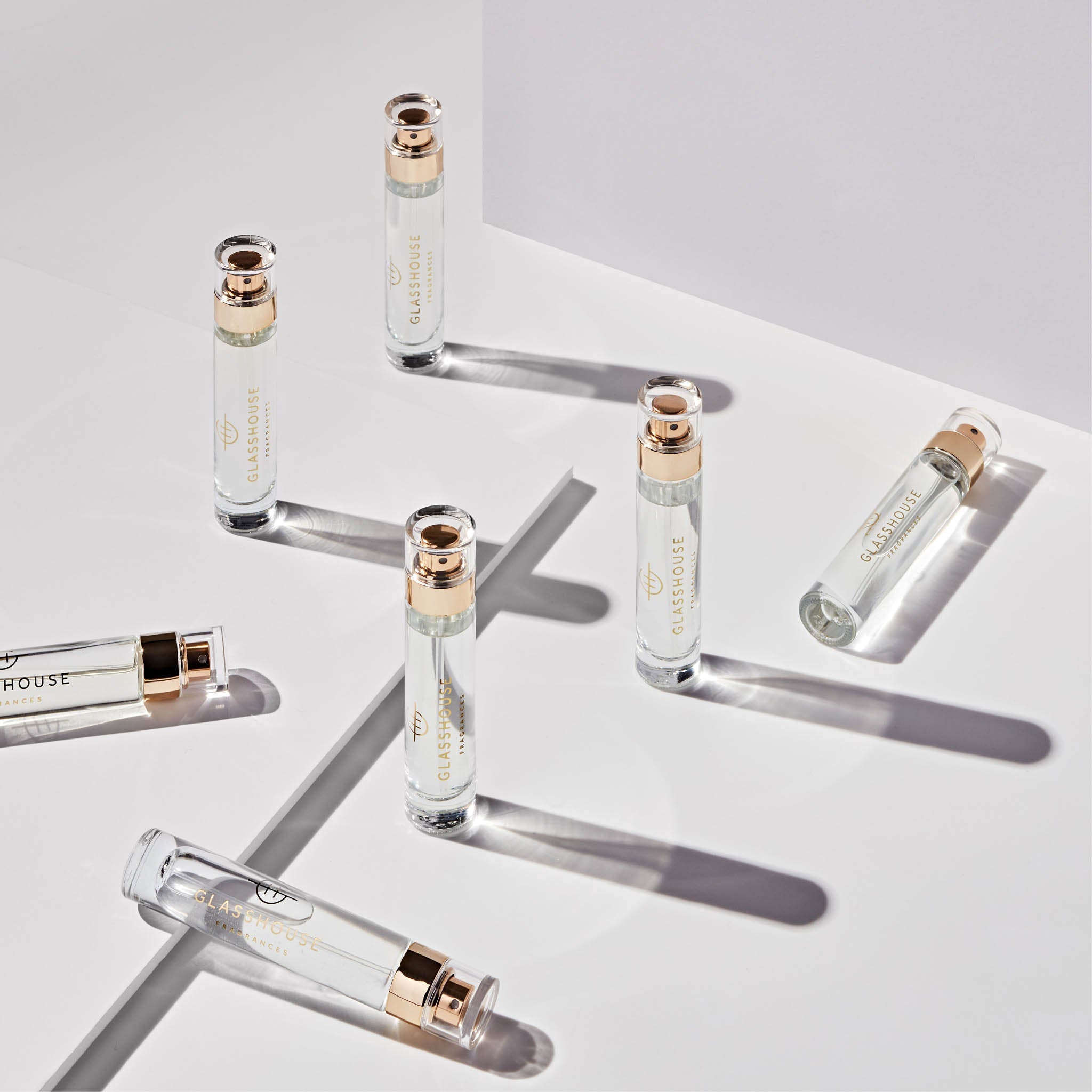Glasshouse Fragrances 14mL Eau de Parfum multiple spray vials arranged across a white tabletop